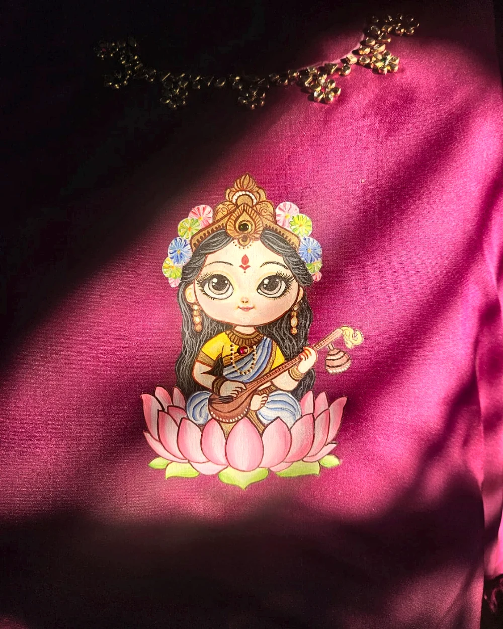 Hand-painted goddess motif on deep magenta fabric