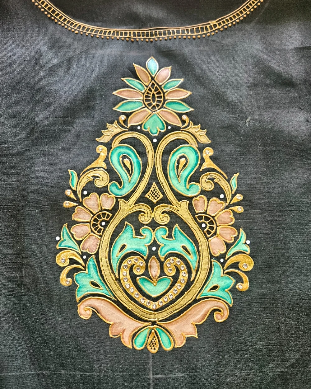 Ornamental turquoise, peach and gold hand-painted motif on black fabric