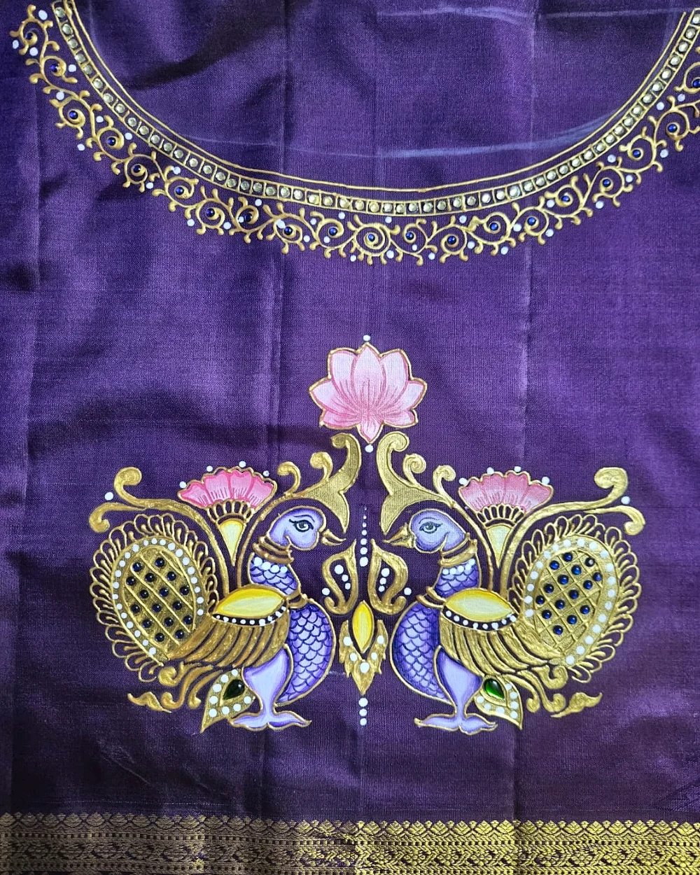 Paired peacock motif hand-painted in gold, lilac and pink on purple fabric